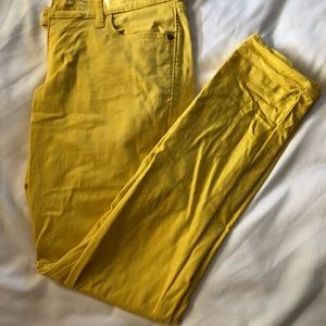 Golden yellow skinny jeans.